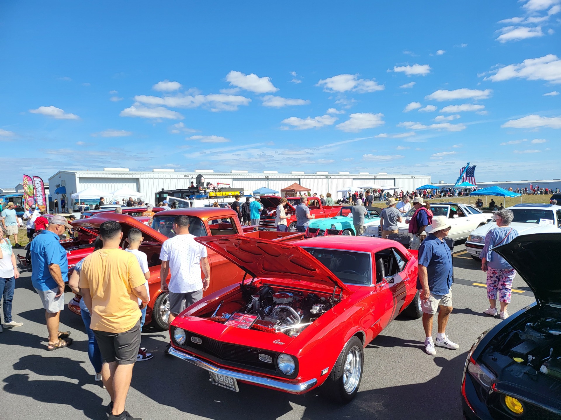 Visitors explore classic cars at Planes, Trains and Automobiles at Plant City Airport